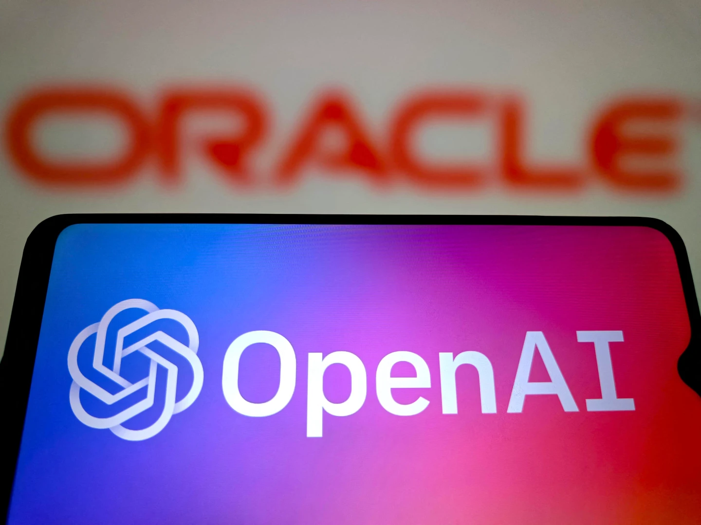 OpenAI與甲骨文(Oracle)的LOGO示意圖。法新社