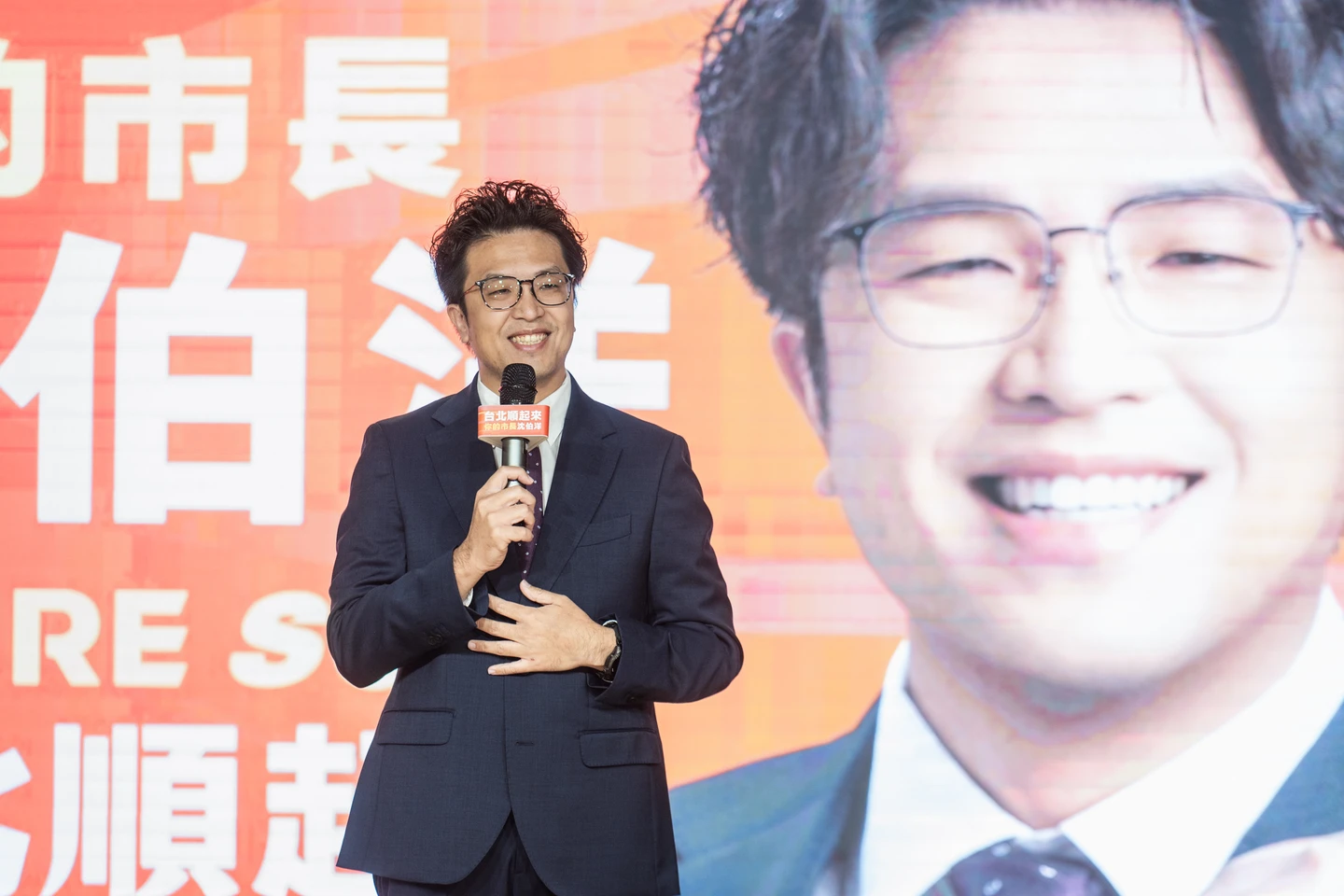 沈伯洋競選主視覺橘色滿佈　「台北順起來」牽動經濟、無限可能